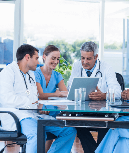 Team of experts at LAC Healthcare headquarters discussing product innovation